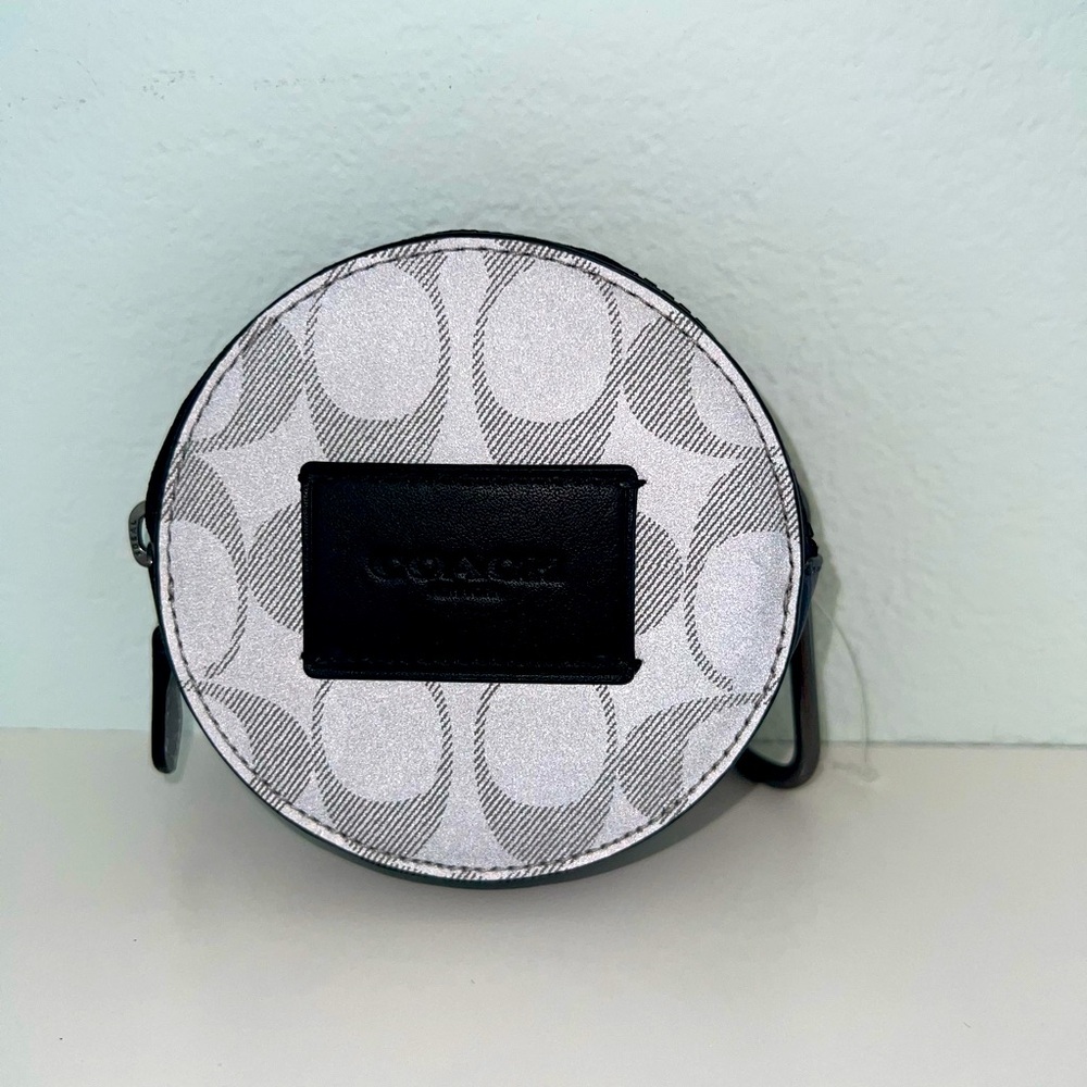 Coach round hybrid pouch in reflective signature canvas